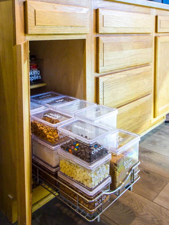 pull-out-drawer-in-kitchen-cabinet-with-organized-baking-supplies